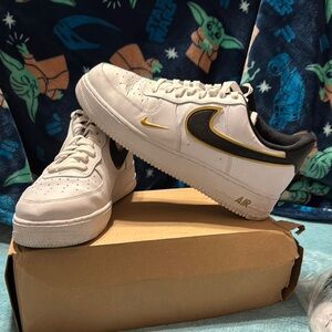 Nike White and Black Sneakers with Gold Accents